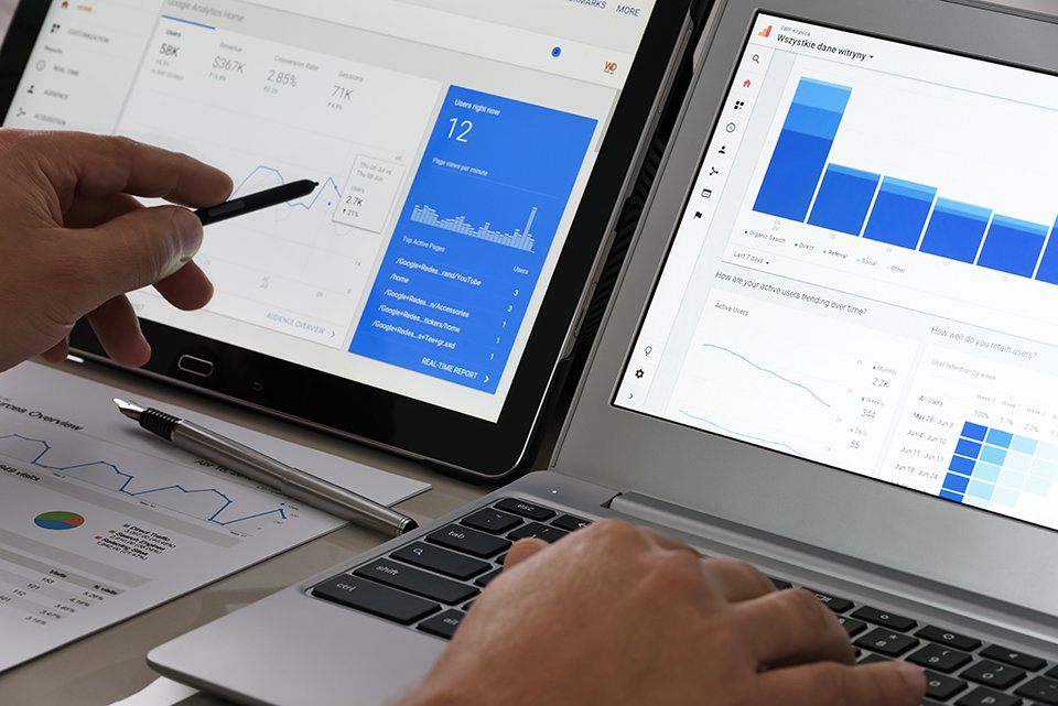 laptop with analytics graphs on screen